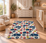 Semi truck pattern rug in a nursery beside a crib and dresser