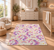 unicorn heads pattern with rainbows rug in a nursery beside a crib and dresser