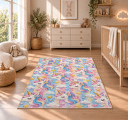 unicorn heads and stars pattern on pastel stripes rug in a nursery beside a crib and dresser