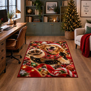 A happy golden puppy in a Santa hat and red sweater raises a soft paw toward the viewer; rug shown in a decorated home office