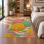 Yarn Balls and Knitting Needles Rug in a bedroom beside the bed