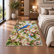 Bluebird on Blossom Branch Rug in a bedroom beside the bed