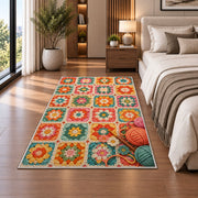 Granny Square Rug in a bedroom beside the bed