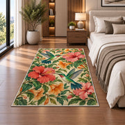 Hummingbirds and Hibiscus Rug in a bedroom beside the bed