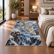 Leaping Snow Leopard Rug in a bedroom beside the bed