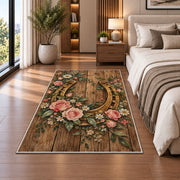 Horseshoe and Roses Rug in a bedroom beside the bed