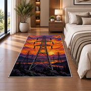 high voltage tower sunset rug in a bedroom beside the bed