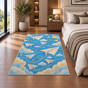 Paper Airplane Rug in a bedroom beside the bed