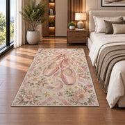 Pink pointe shoes floral rug in a bedroom beside the bed