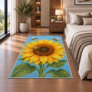Sunflower and Bees Rug in a bedroom beside the bed