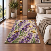 Lavender and Bees Rug in a bedroom beside the bed