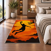 Slam Dunk Sunset Silhouette rug in a bedroom beside the bed