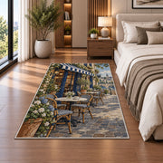 Parisian Sidewalk Cafe rug in a bedroom beside the bed