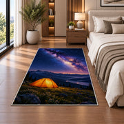 Orange Tent Under the Milky Way rug in a bedroom beside the bed