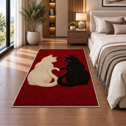 Cats with Heart Tails rug in a bedroom beside the bed