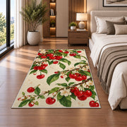 Cherry Branch Rug in a bedroom beside the bed