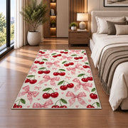 Cherry and Bow Pattern Rug in a bedroom beside the bed
