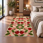 Geometric Cherry Rug in a bedroom beside the bed