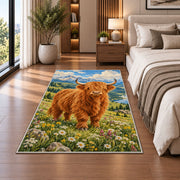 Highland Cow Mountain Meadow Rug in a bedroom beside the bed