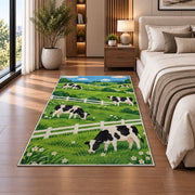 Dairy Cows by White Fence rug in a bedroom beside the bed