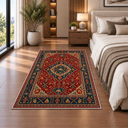 Persian Style Firefighter rug in a bedroom beside the bed