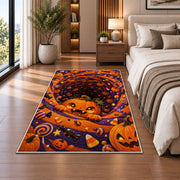 Cute pumpkin and candy spiral area rug in a bedroom beside the bed