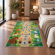 Green animal footprint hopscotch rug with colorful numbers, flowers and friendly animals, shown from an angled room perspective