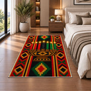 Kwanzaa Kinara Rug in a bedroom beside the bed
