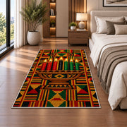 Kente Pattern Kwanzaa Rug in a bedroom beside the bed
