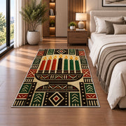 Mudcloth Kwanzaa Rug in a bedroom beside the bed