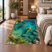 Kayaks on turquoise lake rug in a bedroom beside the bed