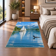 Sailboat and loon on lake rug in a bedroom beside the bed