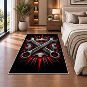 Crossed wrenches and gear rug in a bedroom beside the bed