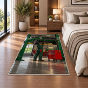 Classic car on a garage lift rug in a bedroom beside the bed