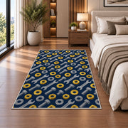 Nuts and bolts pattern rug in a bedroom beside the bed