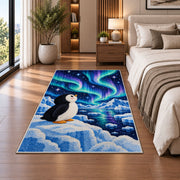 Aurora Penguin Rug in a bedroom beside the bed