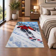 Downhill skier rug in a bedroom beside the bed