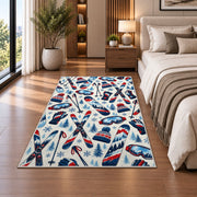 Ski gear pattern rug in a bedroom beside the bed