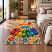 Crayon Rainbow Rug in a bedroom beside the bed