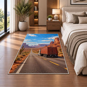 Semi truck on desert highway rug in a bedroom beside the bed