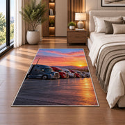 Semi trucks at a truck stop at sunrise rug in a bedroom beside the bed