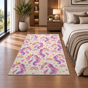 unicorn heads pattern with rainbows rug in a bedroom beside the bed