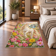 unicorn in a flower garden rug in a bedroom beside the bed