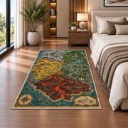 Fantasy island map rug with red volcanic terrain, green forest, and turquoise sea in a bedroom beside a bed