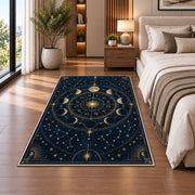 Navy and gold celestial zodiac wheel rug in a bedroom beside the bed