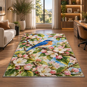 Bluebird on Blossom Branch Rug in a living room with a desk and large windows