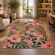 Leopard on Pink Hibiscus Rug in a living room with a desk and large windows