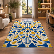 Geometric whisks and measuring cups rug in a living room with a desk and large windows