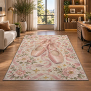 Pink pointe shoes floral rug in a living room with a desk and large windows