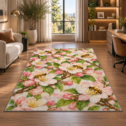 Apple Blossom Bees Rug in a living room with a desk and large windows